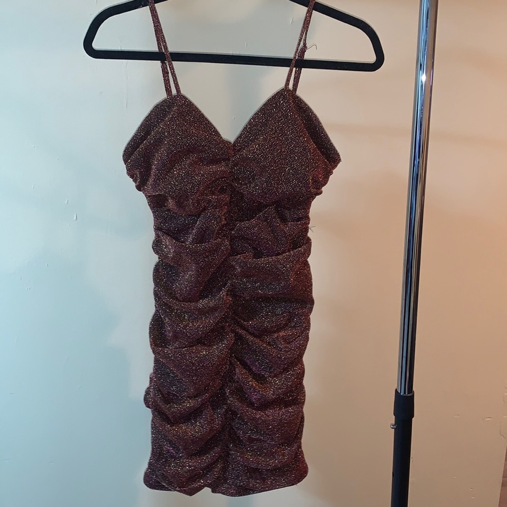 Sparkly dress with thing strips. Size medium.